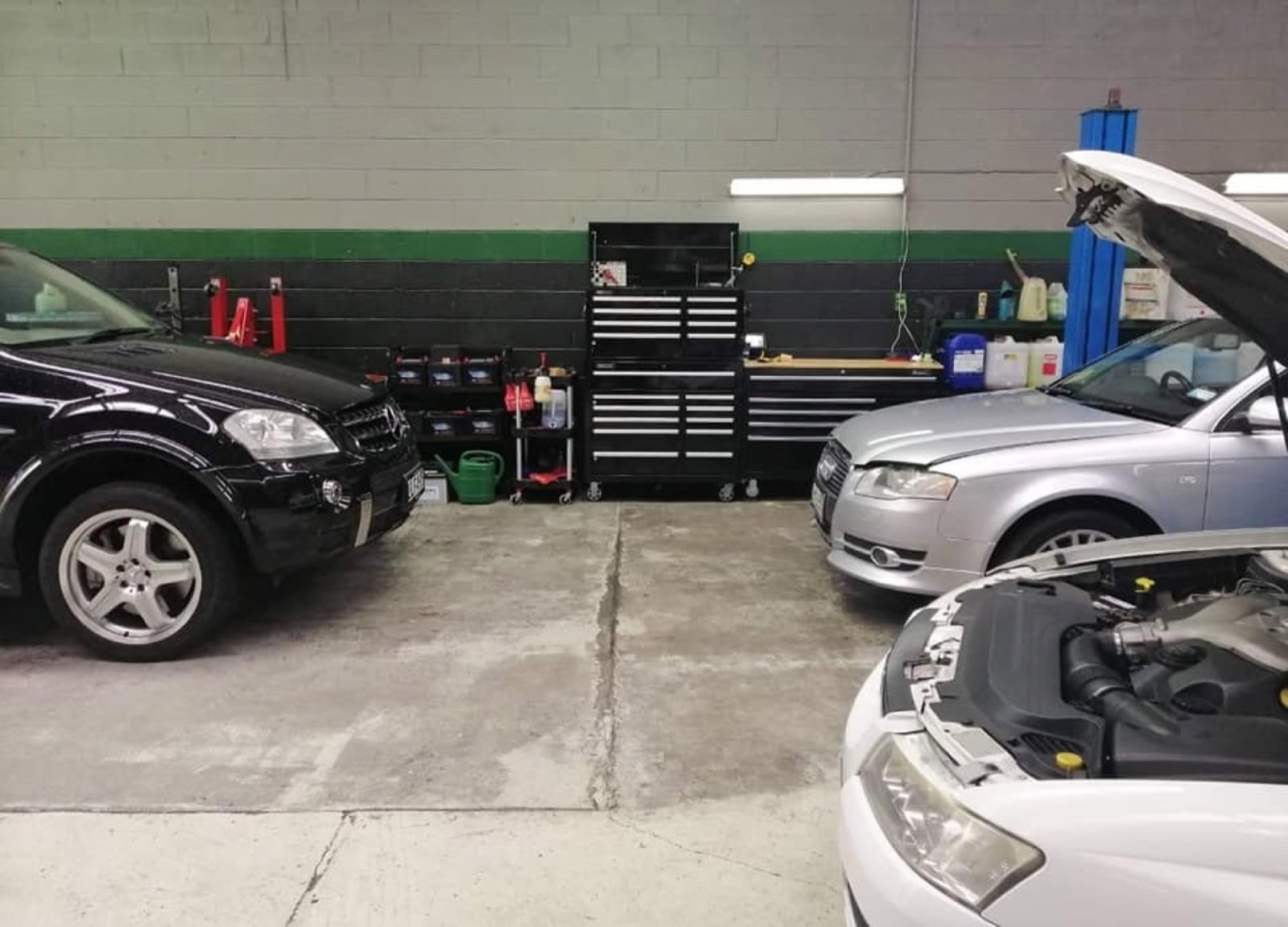 Tidy workshop bay at Precision Automotive in New Lynn — service in progress